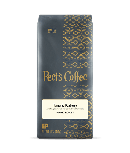 Peet's Coffee Tanzania Peaberry dark roast coffee package on a dark background