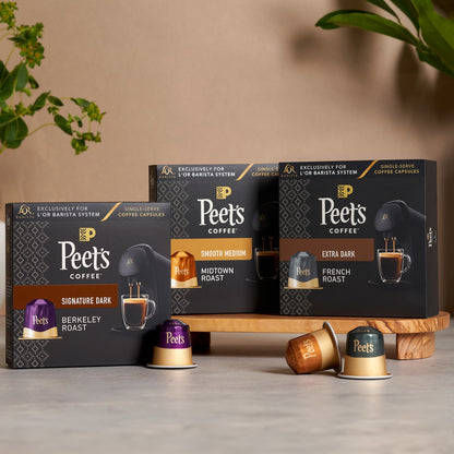 Peet's Coffee packaging on a wooden stand with a neutral background